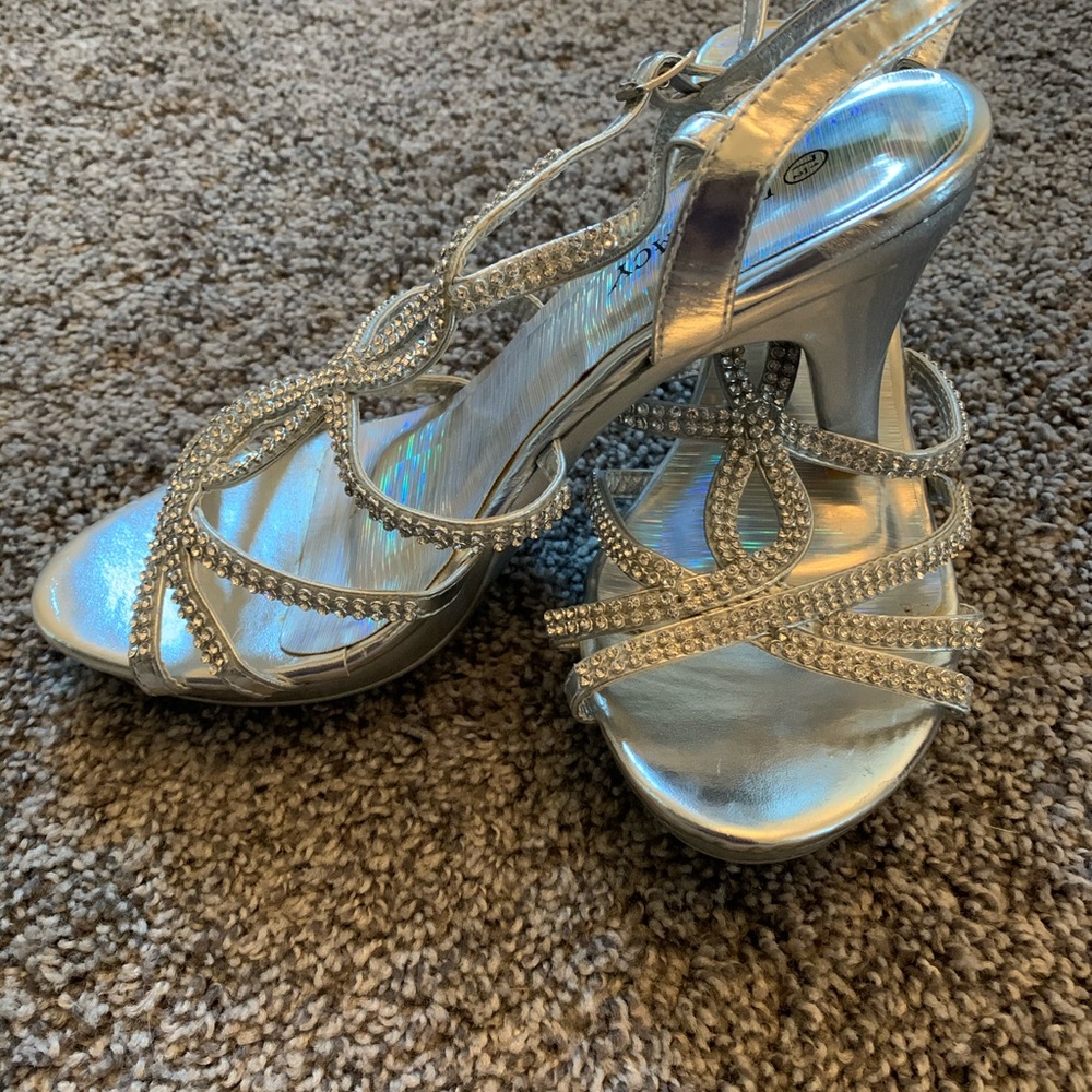 Sliver and rhinestone front cross over heels.